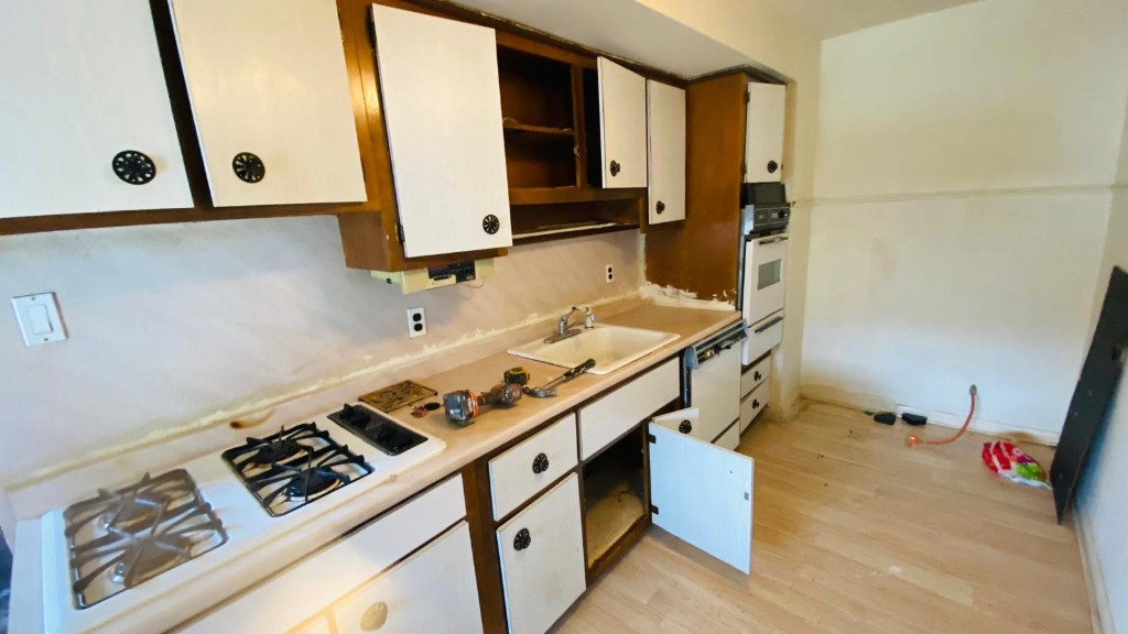 Kitchen renovation in progress — cabinets, appliances, and finishing work
