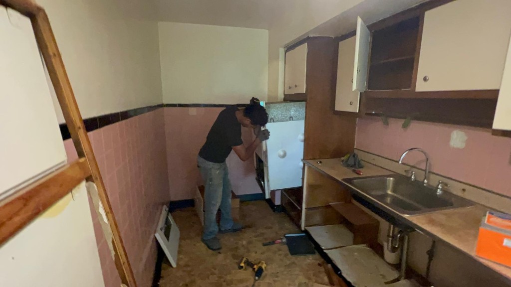 Kitchen renovation — appliance installation and tile detail